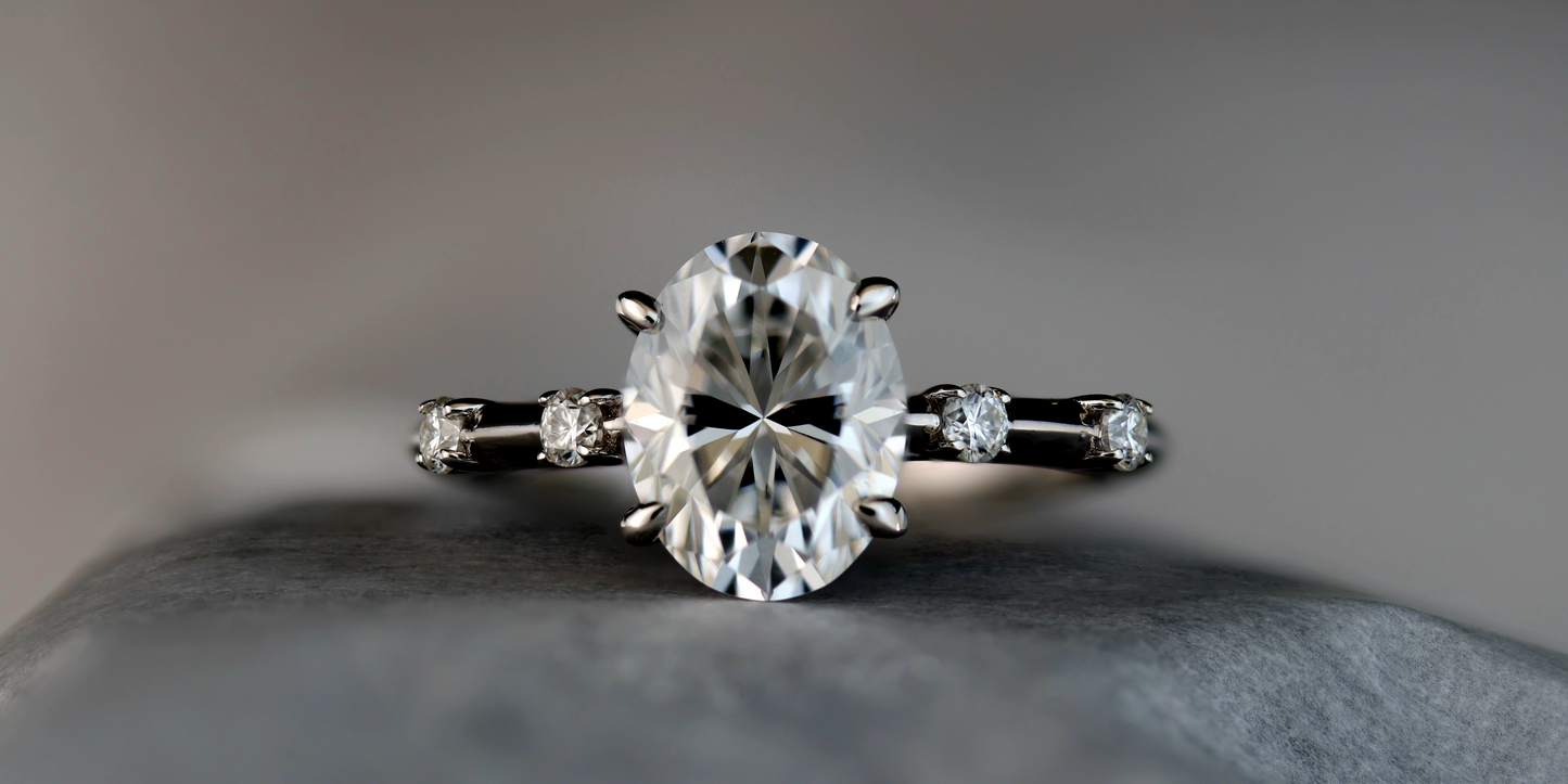 Solitaire Series: Oval Diamond with 4 Prong Setting Side Stones