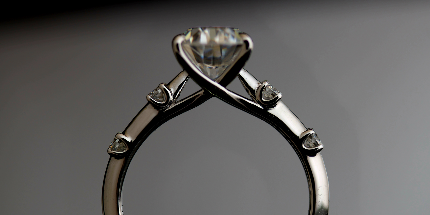 Solitaire Series: Oval Diamond with 4 Prong Setting Side Stones